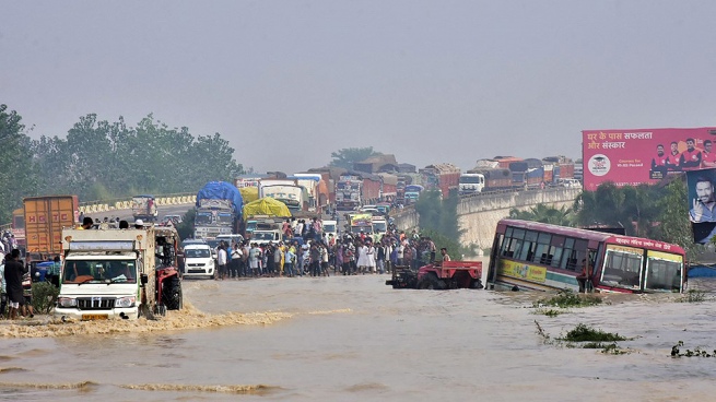 At least 10 dead and 18 missing from floods in India