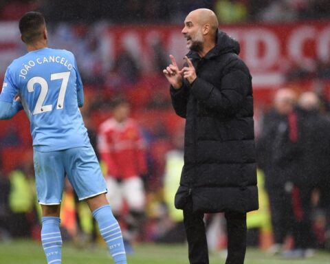 Cancelo y Guardiola.