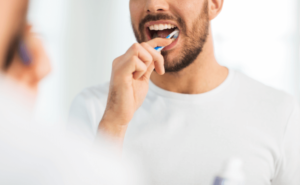 Why does brushing your teeth prevent complications from the coronavirus?