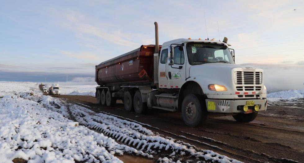 Encapsulated trucks of community members begin transporting mineral in Cusco