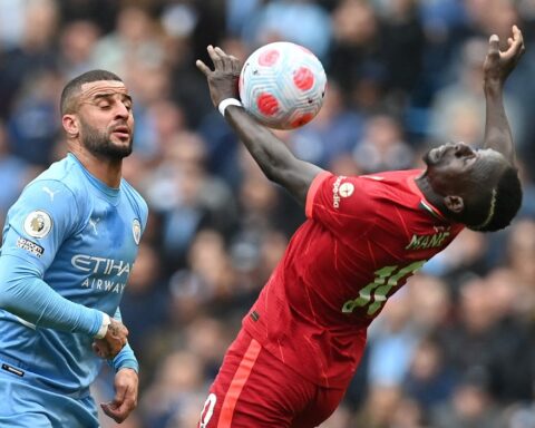 Manchester City tops Premier League after draw with Liverpool