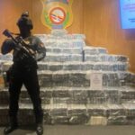 DNCD agents guard the 1,129 packets of cocaine seized at the port of Caucedo on Sunday.