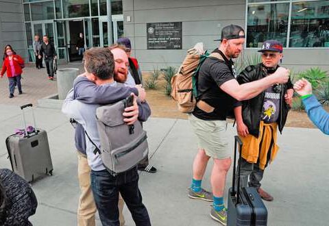 They welcome refugees with hugs