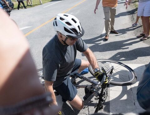 Biden ended up on the ground trying to get off his bike