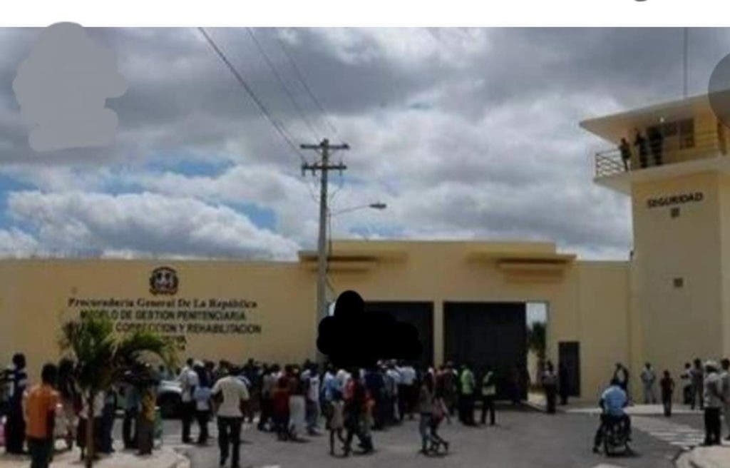 A group of people and relatives of the inmates gathered around the Anamuya Correction and Rehabilitation Center, where the prisoners staged a riot on Monday.