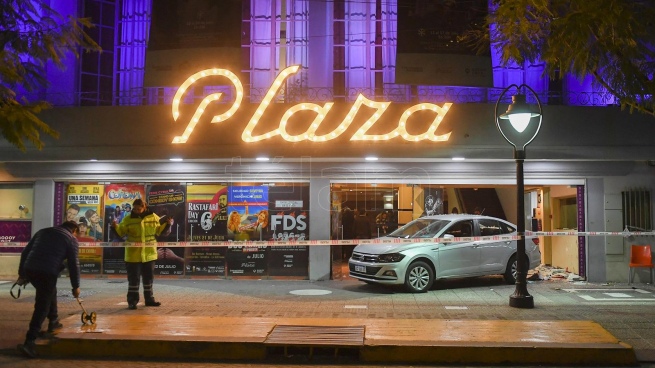 One of the women run over at the door of the theater in Mendoza remains serious