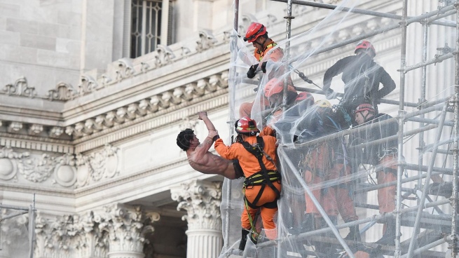 They rescued a former police officer who threatened to throw himself from a scaffolding