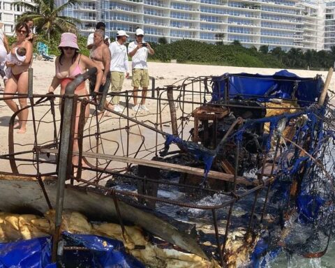 A charred raft with the uniform of a Cuban policeman arrives in Miami Beach