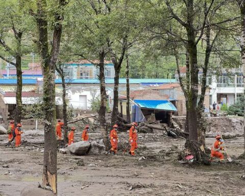 Floods in China and New Zealand leave dozens dead and hundreds of evacuees