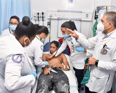 A medical group from the Ramón de Lara military hospital assists one of the miners after his rescue on Tuesday