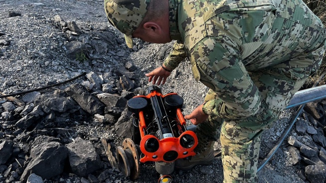 They activated a drone and divers to rescue ten workers trapped in a flooded mine