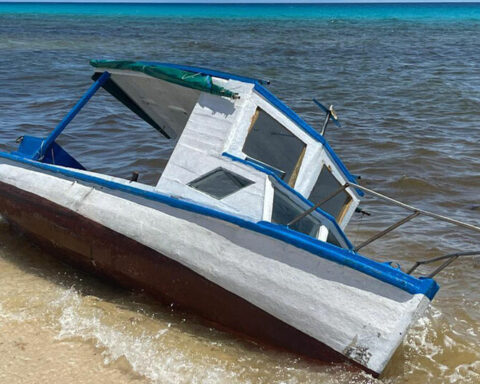 A fisherman points to Cancun as the route used by Cuban coyotes and rafters