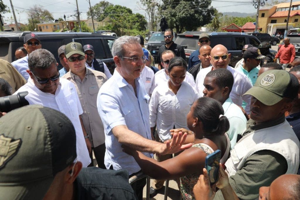 President Luis Abinader talks with families affected by Hurricane Fiona in Samaná