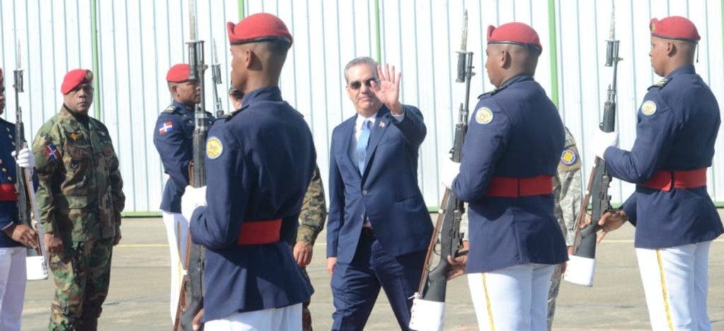 President Luis Abinader waves as he walks to the plane that will take him to Washington for a meeting with Vice President of the United States Kamala Harris