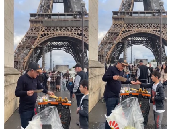 Deivinson, the Colombian who did not get stranded in Paris, set up a sale of cobs at the foot of the Eiffel Tower