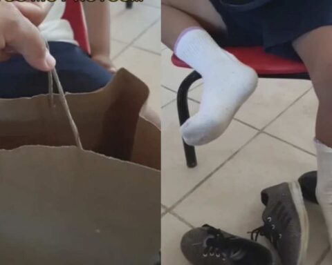 Teacher is moved by giving new shoes to a student who arrived with broken shoes