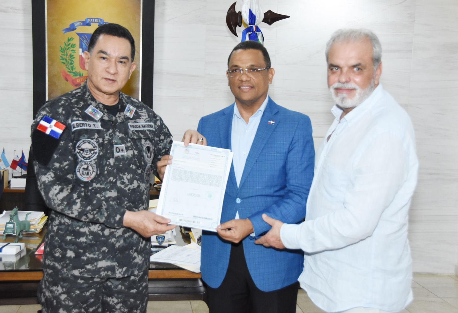 Titling Director delivers property titles to 11 police detachments