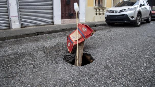 Neighbors say sinkhole is formed after earthquake