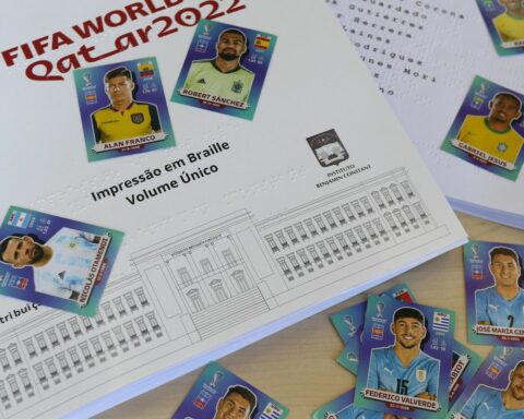 Visually impaired people receive World Cup album in braille
