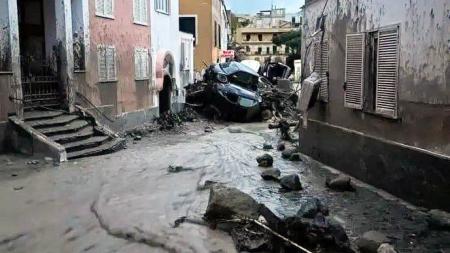 A woman died and eleven people are missing from an avalanche near Naples