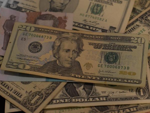 Dollar registers a new loss and falls below $4,900