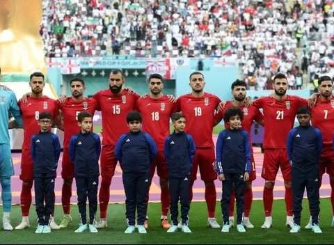 The eleven Iranian starters for the match against England refrain from singing their anthem