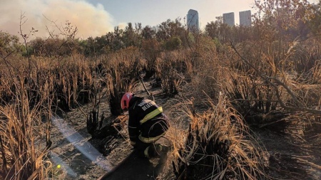 Firefighters continue to work in the Ecological Reserve to extinguish the fire