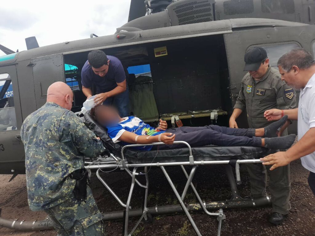 An FTC helicopter transports an indigenous person bitten by a snake