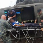 An FTC helicopter transports an indigenous person bitten by a snake