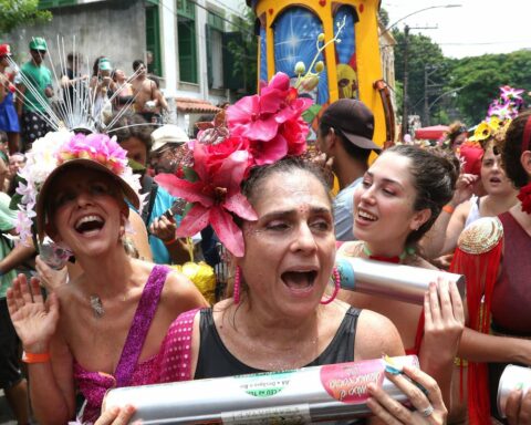 Revelers celebrate the return of Carnival in Rio with the block Céu na Terra