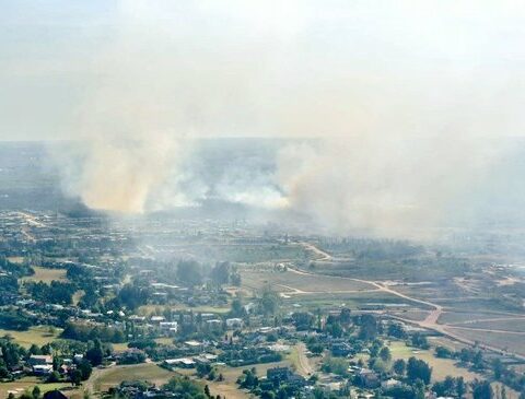 Firefighters fight a fire in a private neighborhood of La Tahona