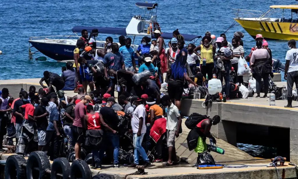 Mystical ceremony, fuel and candle lighting caused boat fire in Haiti