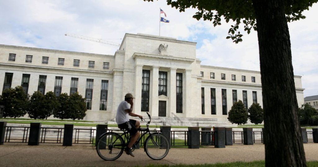 Fed holds rates, points to possible cut in September