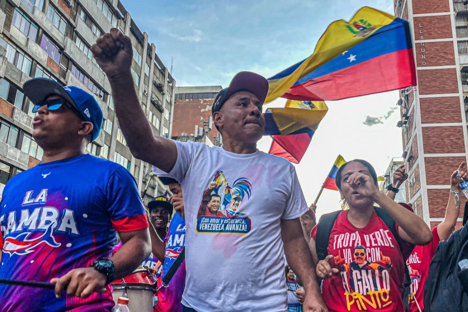 Government supporters and public workers lead march in support of Maduro