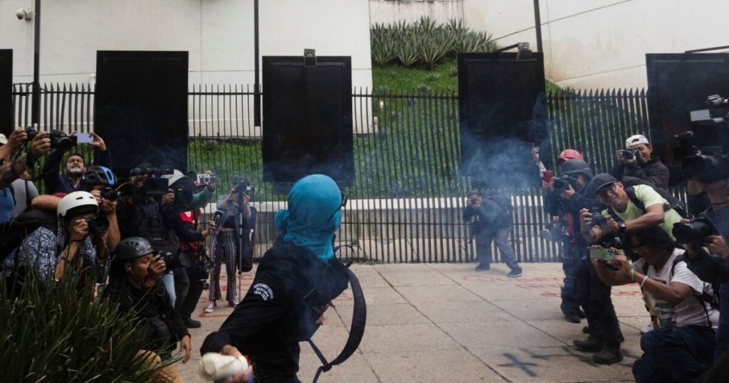 Protesters throw firecrackers at the Senate in protest against the 43