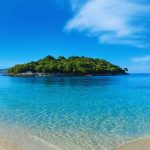 What is the beach with turquoise water and yellow sand that is on the Chilean coast and has a European style?