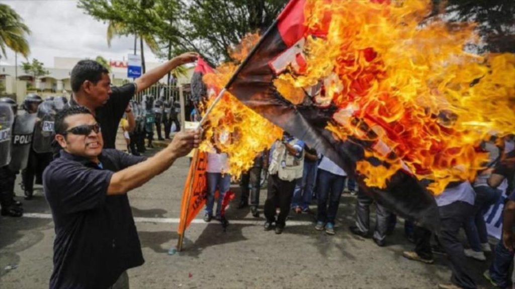 Red and black flag, from emblem of a dictatorship to national symbol