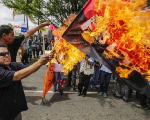 Red and black flag, from emblem of a dictatorship to national symbol