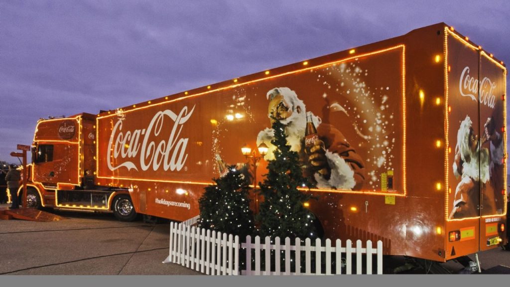 Which communes will the Coca-Cola Christmas Caravan travel through between December 2 and 21?