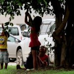 In view of all: children extend their hands in the streets instead of holding a pencil
