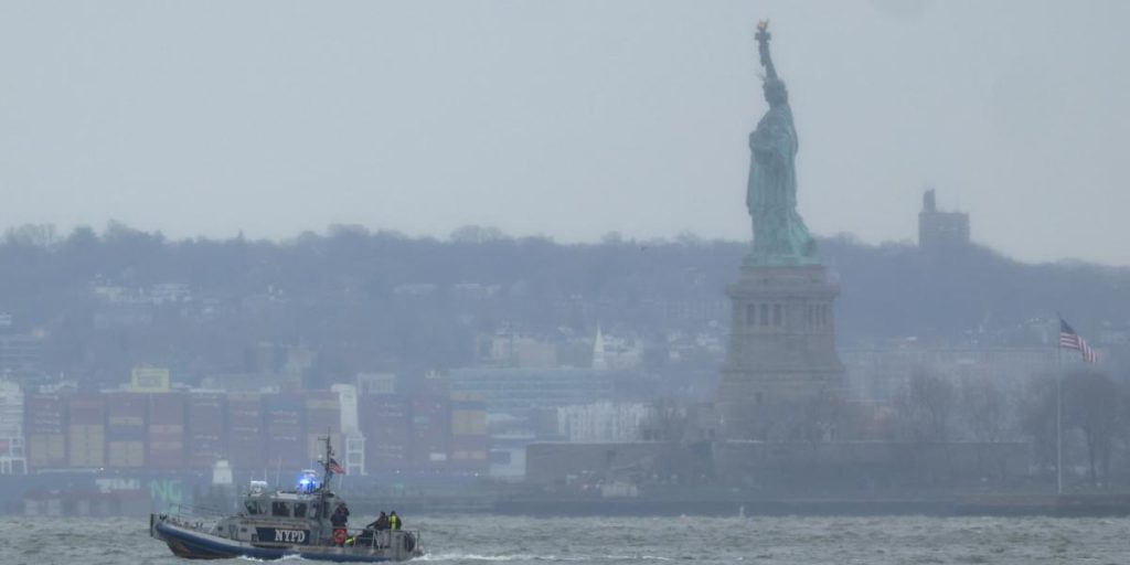 US authorities work to recover the pieces of the star helicopter on the Hudson River
