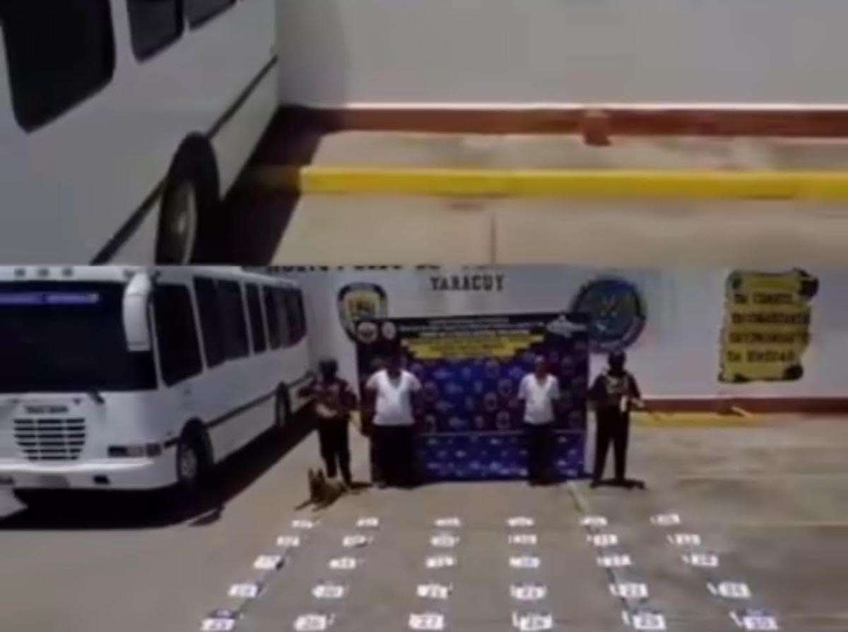 They arrested two passengers carrying 49 cocaine panels