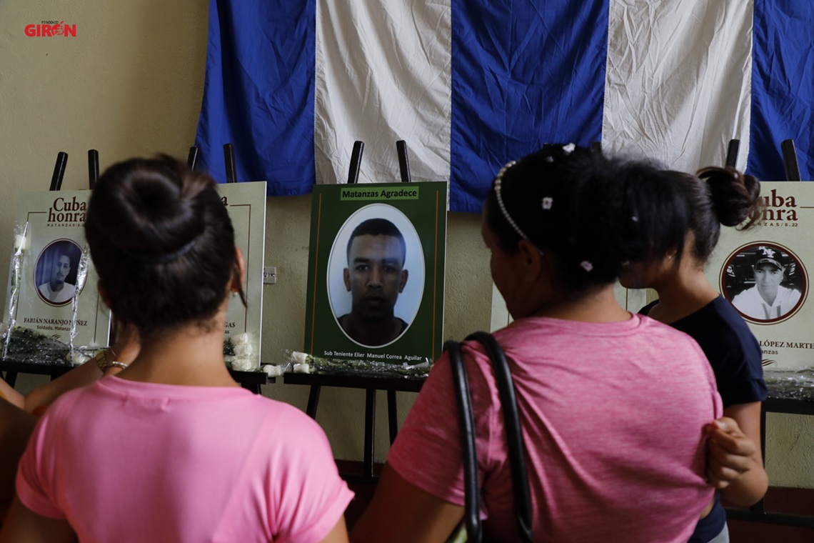 Flowers, tears and candles lit by the victims of the fire in the Superanqueros base