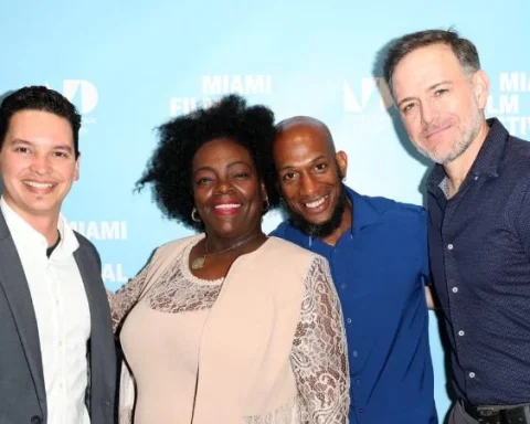 De izquierda a derecha, el periodista Yoe Suárez, productor de campo del documental; la activista Ariadna Mena y su esposo, protagonistas de la obra; y el director Jordan Allott en la alfombra roja del 42 Miami Film Festival
