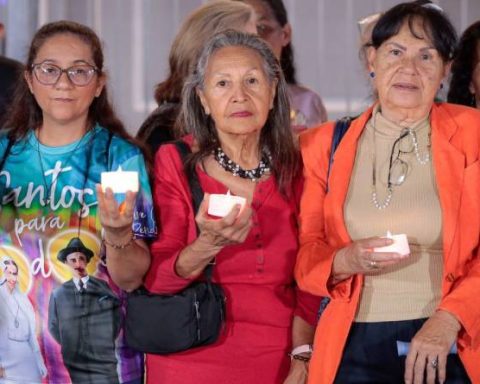 Parishioner marches to honor the first two Venezuelan saints