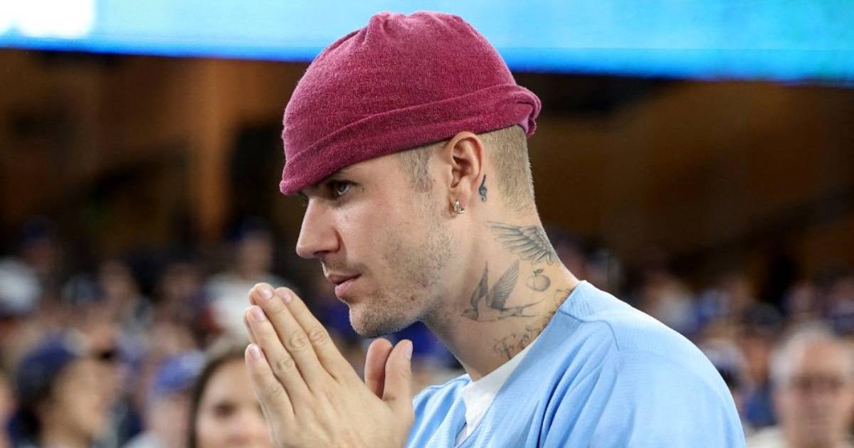 Justin Bieber surprises by stopping to help a young man stranded on the road