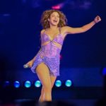Fan pulls Shakira's hair during a concert in Uruguay