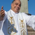 Father Omar, rector of the Cristo Redentor Sanctuary, performs in Lagoa