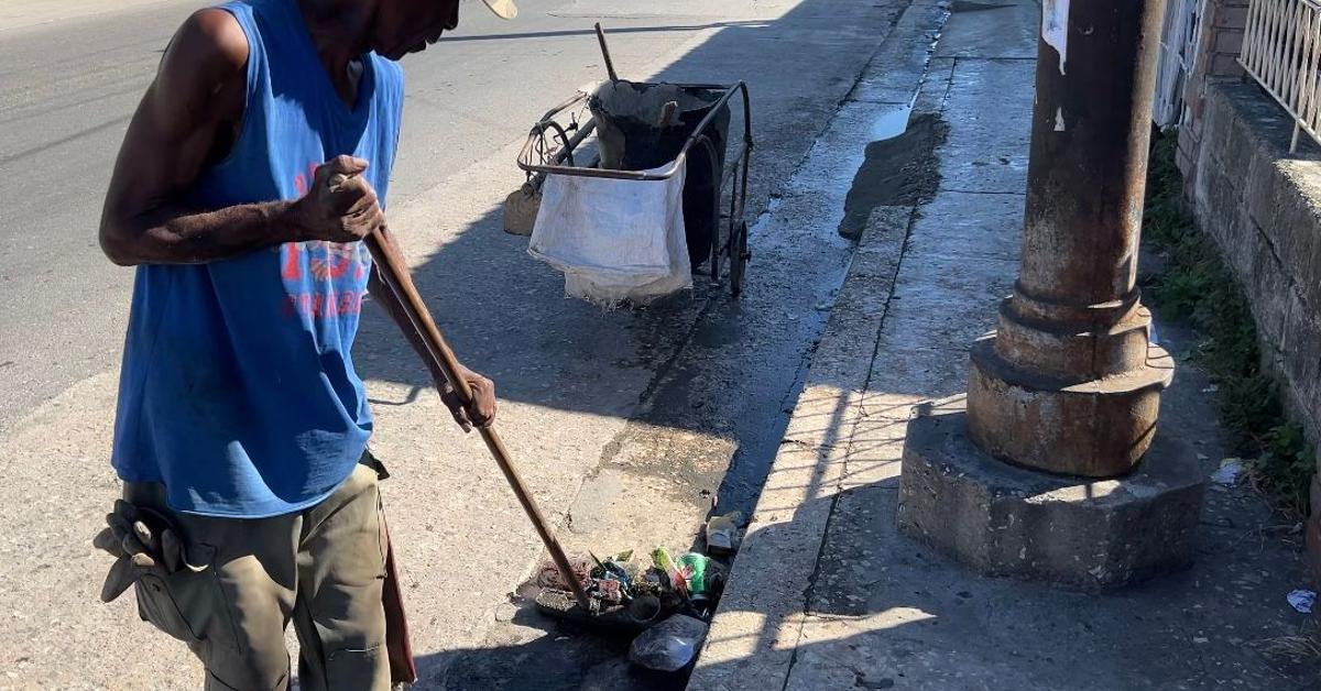 For their daily fight against garbage, Havana's street sweepers earn about ten dollars a month