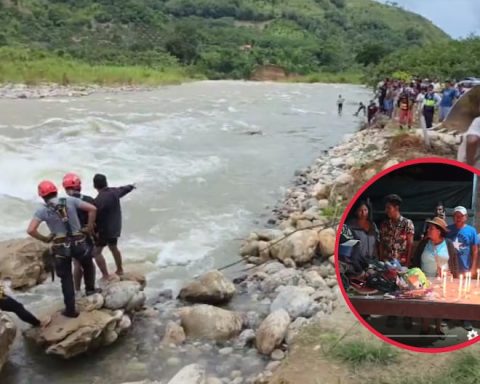 Family watches over the clothes of a fisherman who has disappeared in the Satipo River for three days